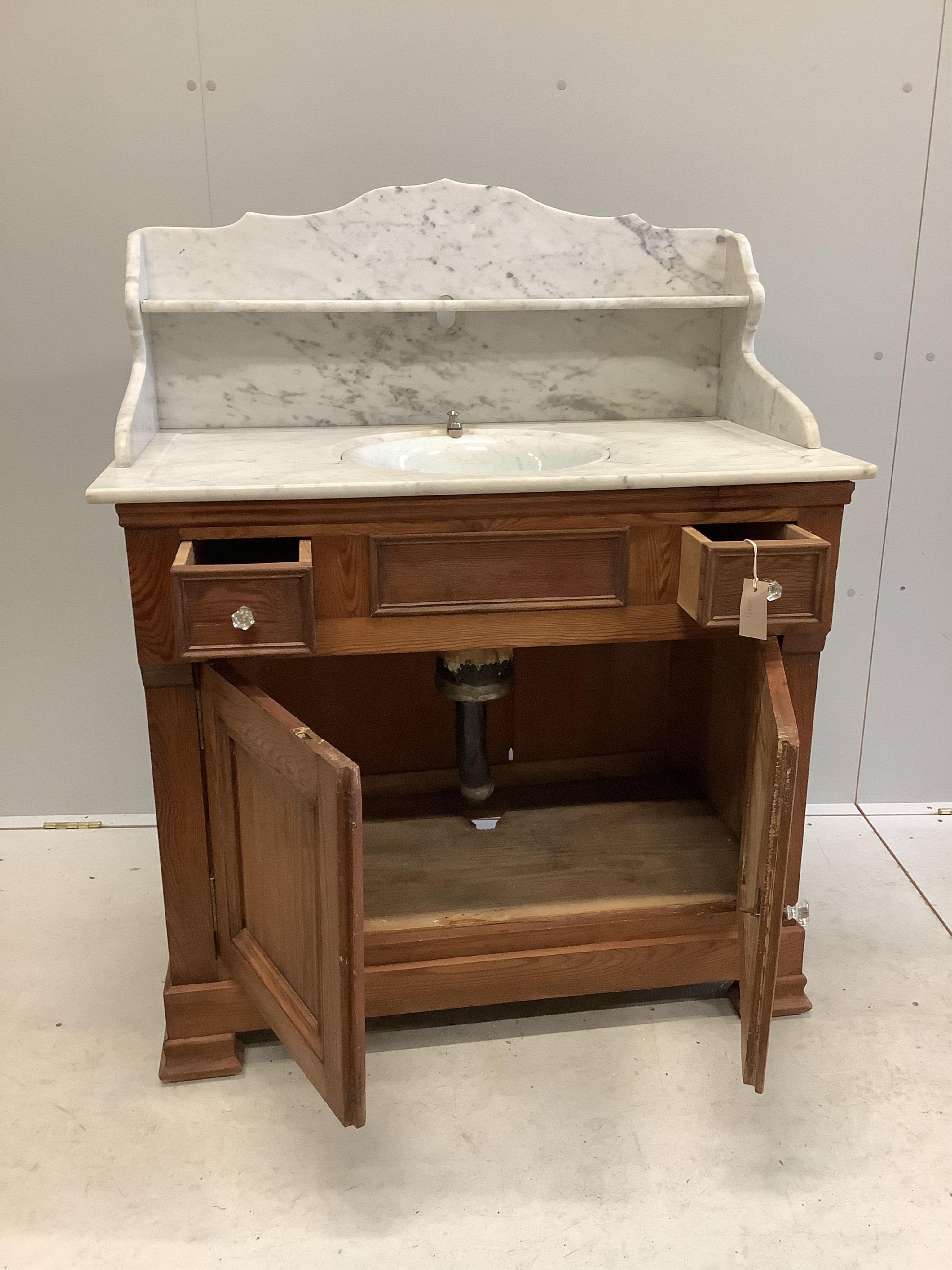 A late 19th century French pine marble top washstand with Boldings Patent swivel sink marked E.P. Concessionaire, Paris, width 92cm, depth 52cm, height 102cm. Condition - fair